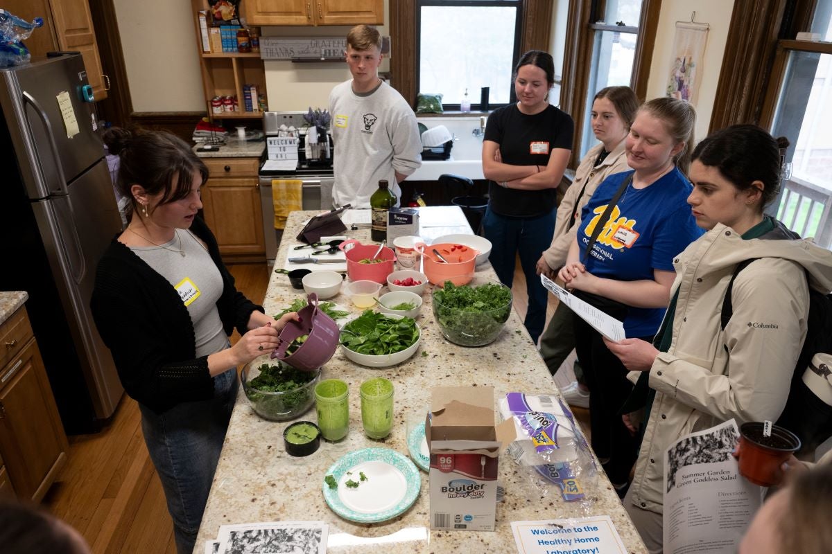 Participants enjoy a cooking demonstration