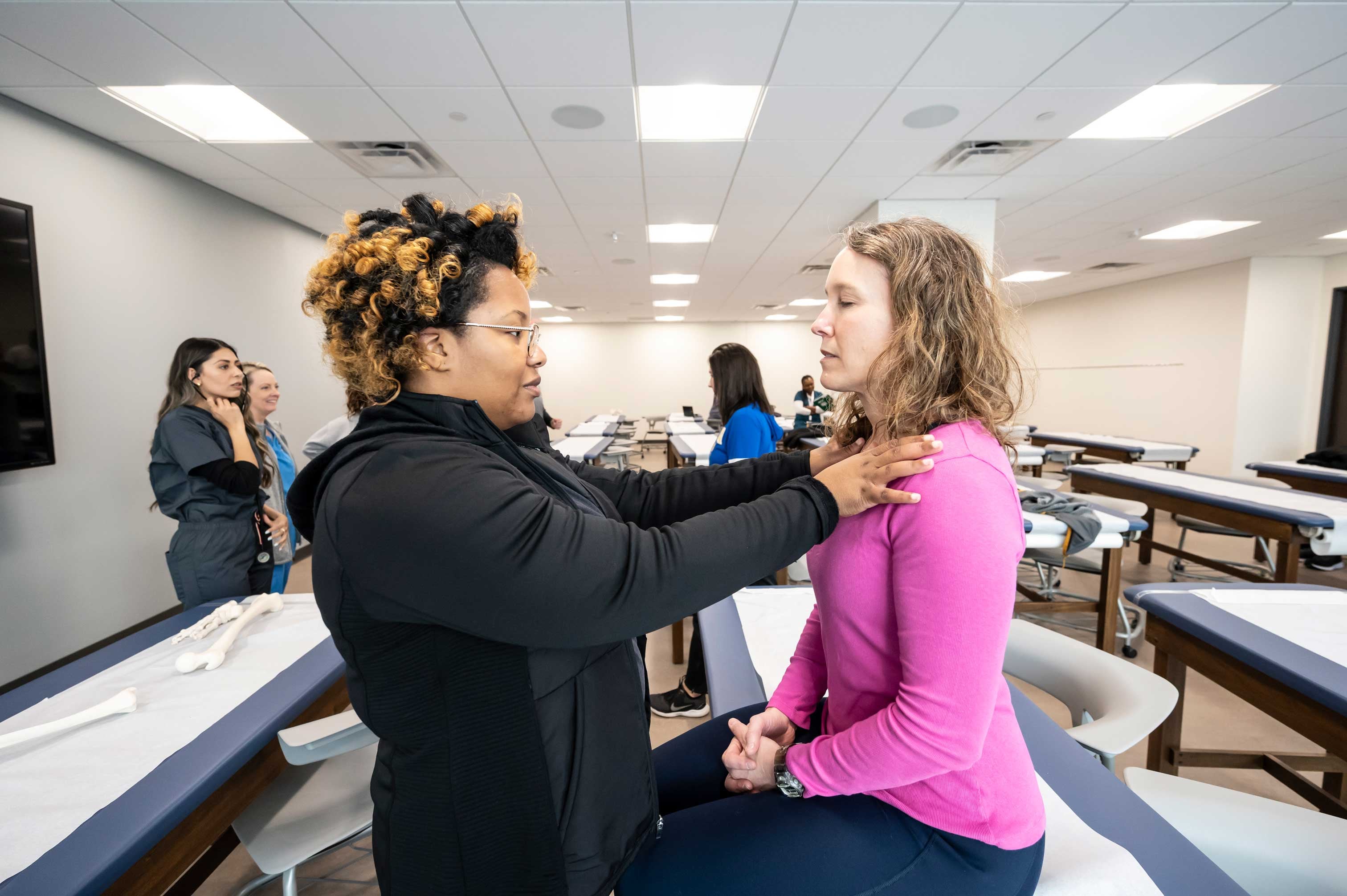 Pitt PA Studies Hybrid students practicing clinical skills at their in-person immersion session.