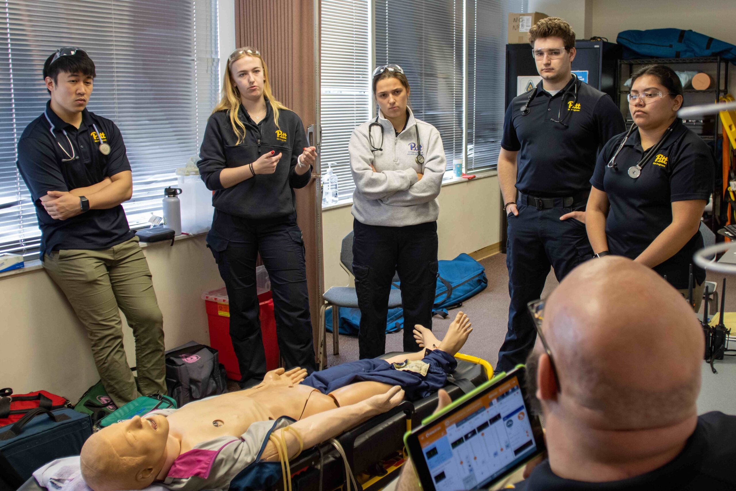 Emergency Medicine students practicing patient assessments in class lab