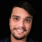 Man with short black hair wearing a black shirt.