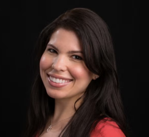 Woman with dark hair wearing a red shirt.