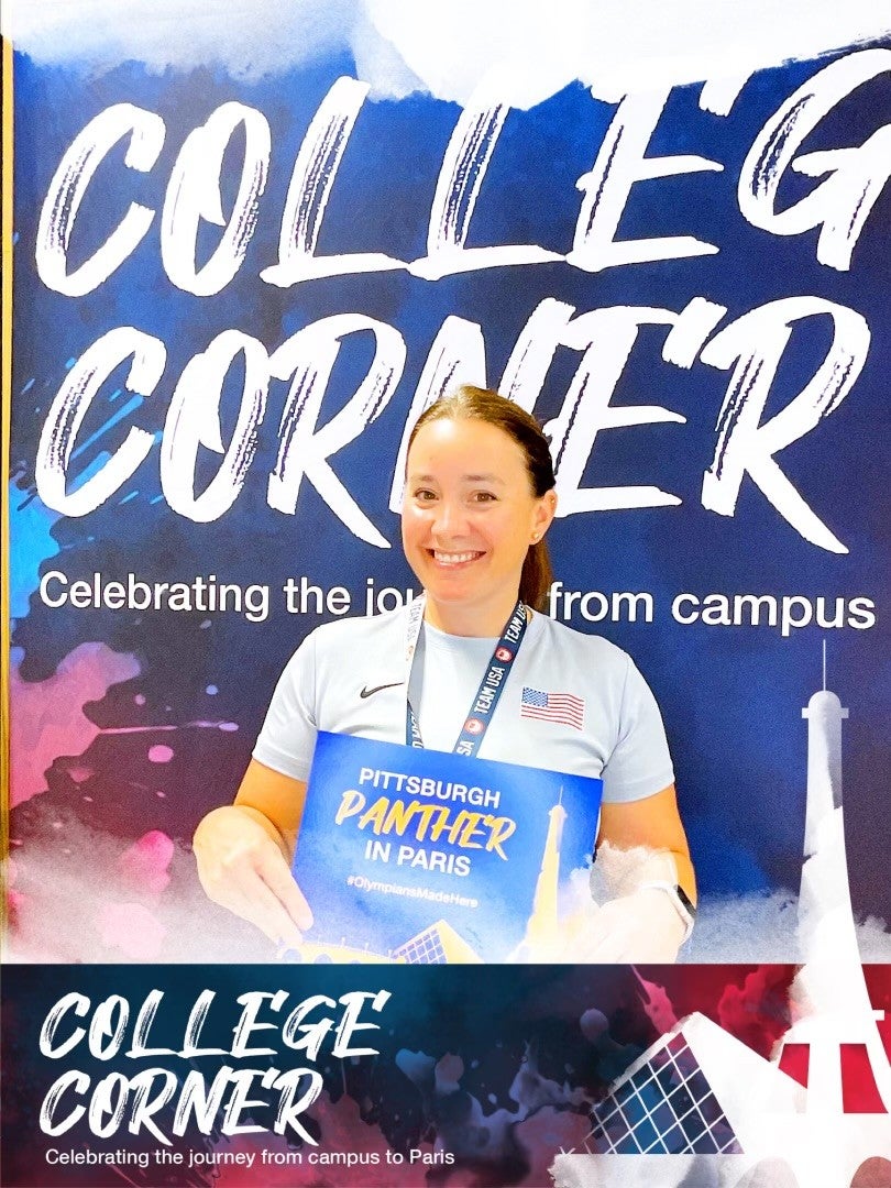 Ashley Koto standing in front of a backdrop with the words College Corner while holding a small sign saying Pittsburgh Panther in Paris