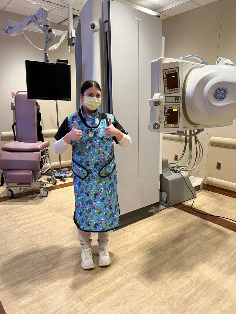 Patterson at one of her clinical placements at UPMC Presbyterian Hospital assisting with a patient’s modified barium swallow study