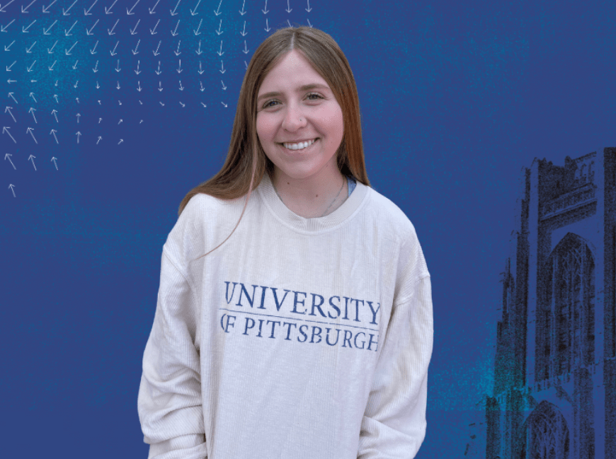 Woman with brown hair wearing a white sweatshirt with "University of Pittsburgh" printed on it.