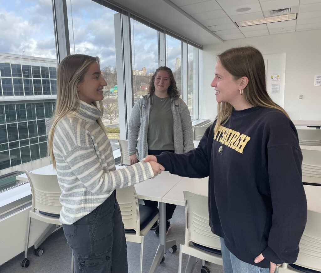 Course Assistants Kara Travanti, Kyra Stolz and Valerie Jordan demonstrate a mission in Level I fieldwork.