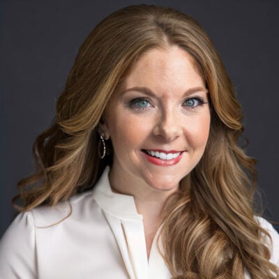 woman with long red hair smiling