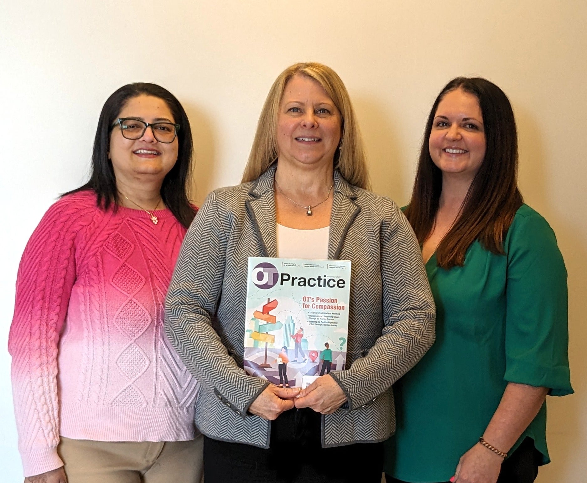 Occupational Therapy faculty Ketki Raina, Ann Marsico and Cara Lekovitch pose for a photo with the OT Practice Magazine.