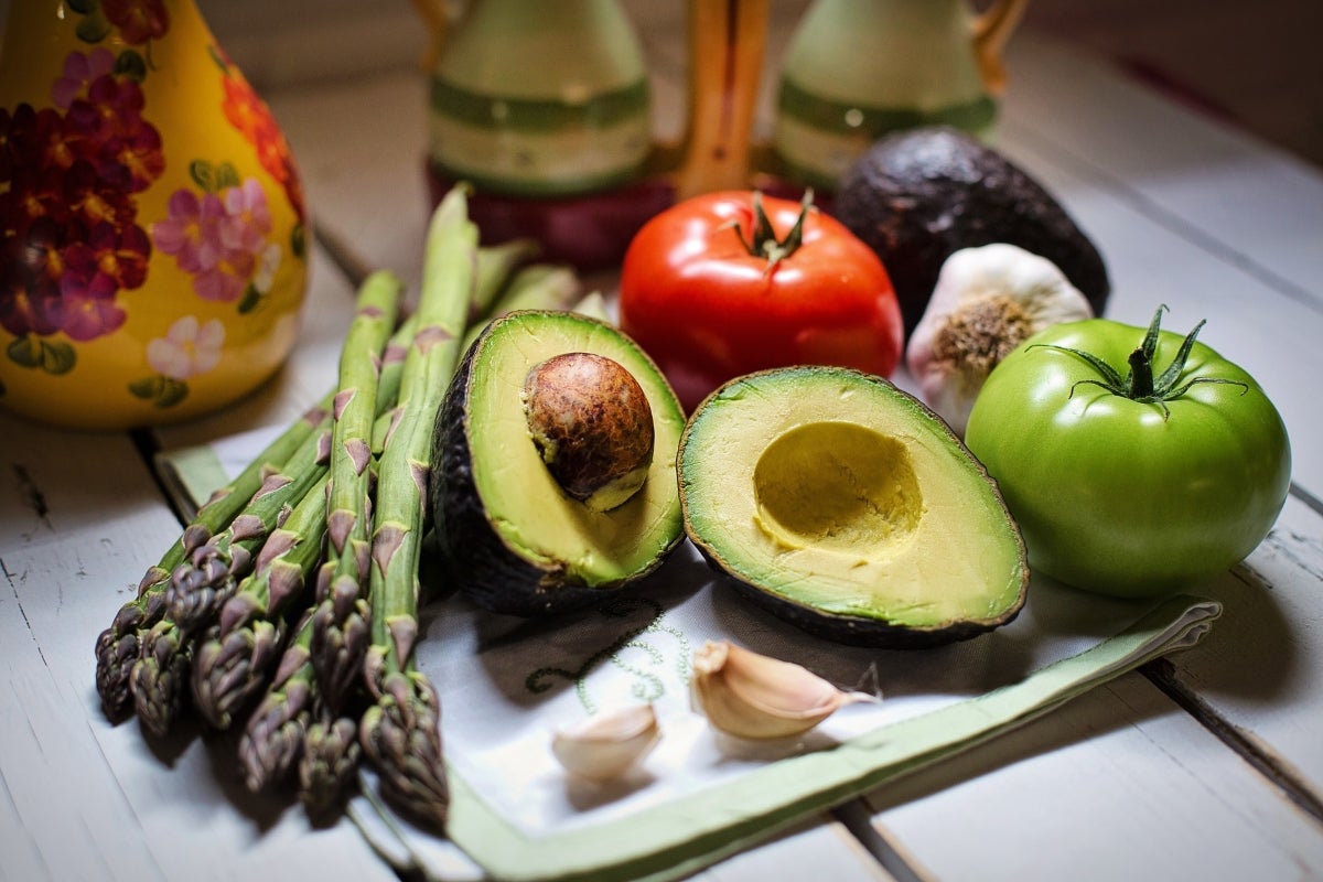 An arrangement of different vegetables sits on a table