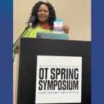 A woman with dark curly hair wearing a green blouse stands at a podium that reads "Western Regional OT Spring Symposium Continuing Education."